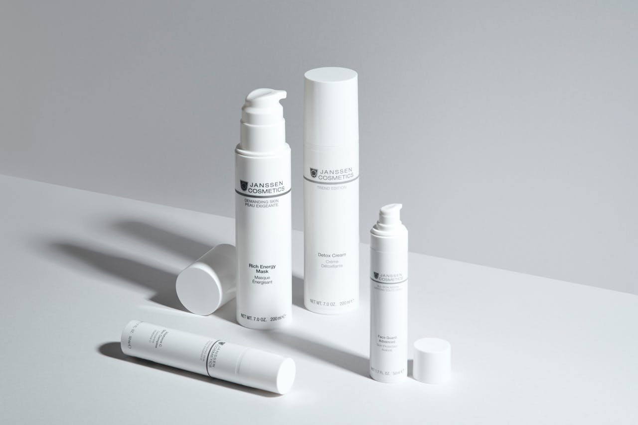 journey A minimalistic display of skincare bottles showcasing Janssen Cosmetics with a clean white backdrop.